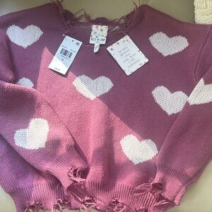 Girls distressed heart sweater NWT.  Size medium plum colored with white hearts.